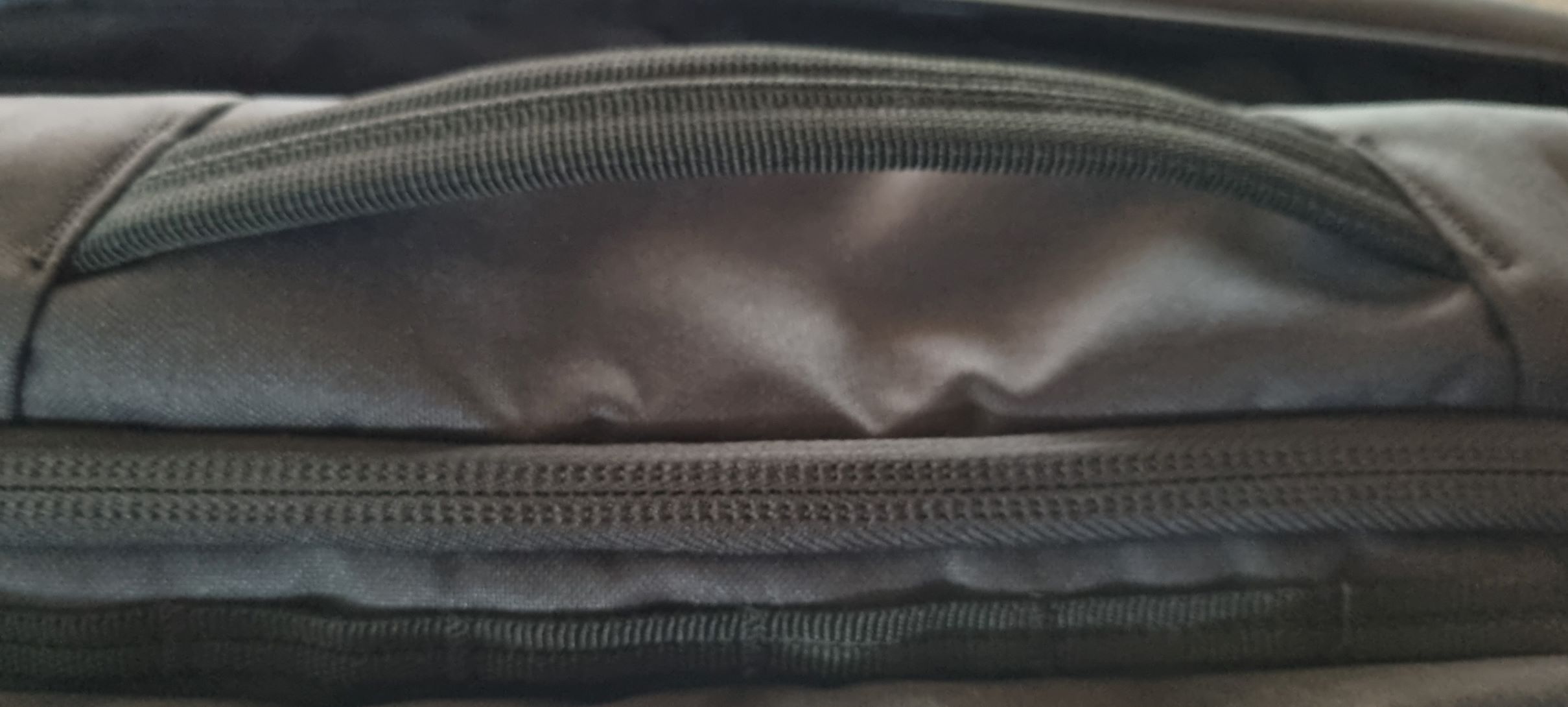 Koffergriff an der Rucksackseite